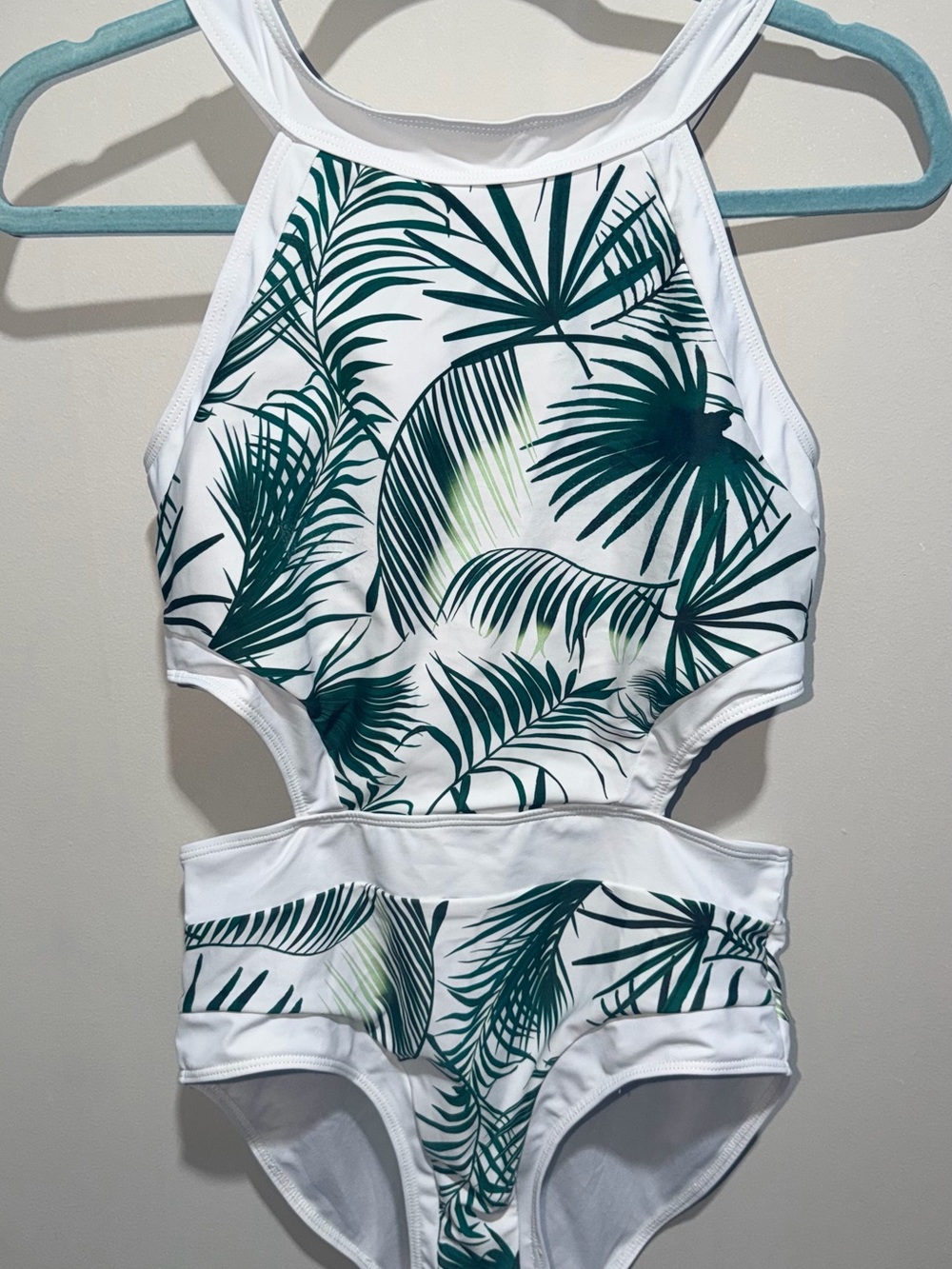 High-Neck White One-Piece Swimsuit with Green Palm Print and Cutout Waist